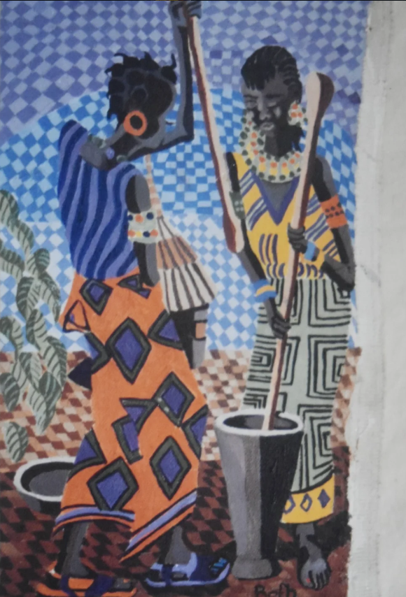 Two women in patterned garments preparing food with a mortar and pestle.